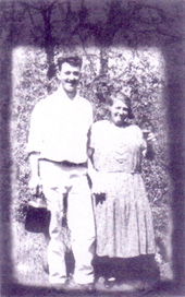 A family photo of Nonna "Rosa" Garré with her son in law Gino Molinaro holding the jug of family wine