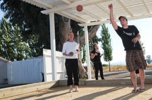 Picture of 3 people enjoying Garre wine while playing Bocce Ball