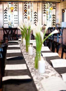 Picture of beautifully decorated table in Cafe Garre for a rehersal dinner.